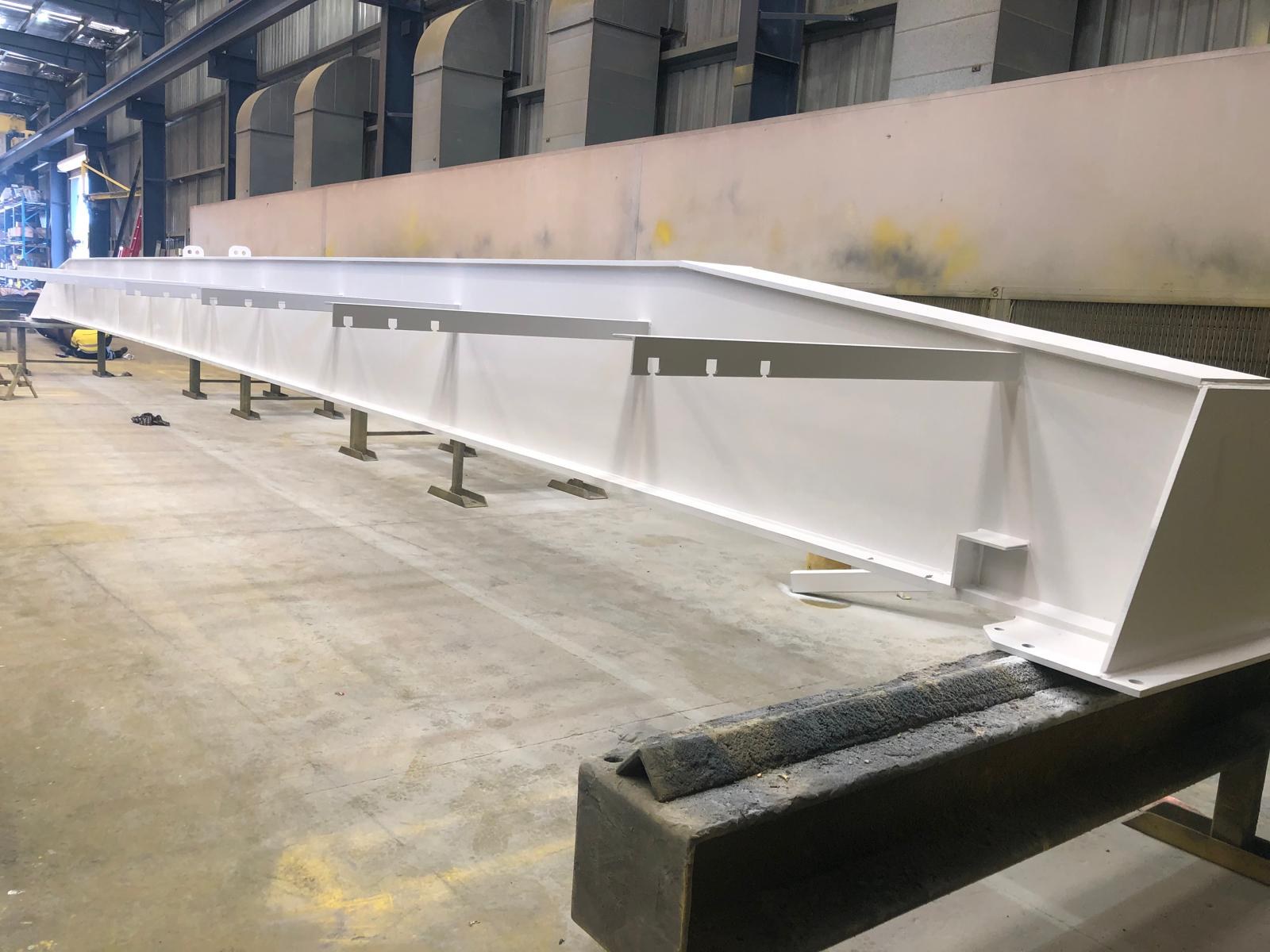 Long fabricated beam after coating
